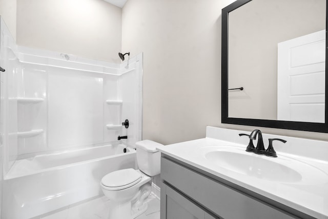 full bathroom featuring washtub / shower combination, vanity, and toilet