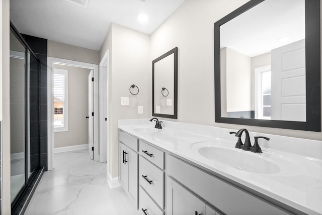 bathroom with an enclosed shower and vanity