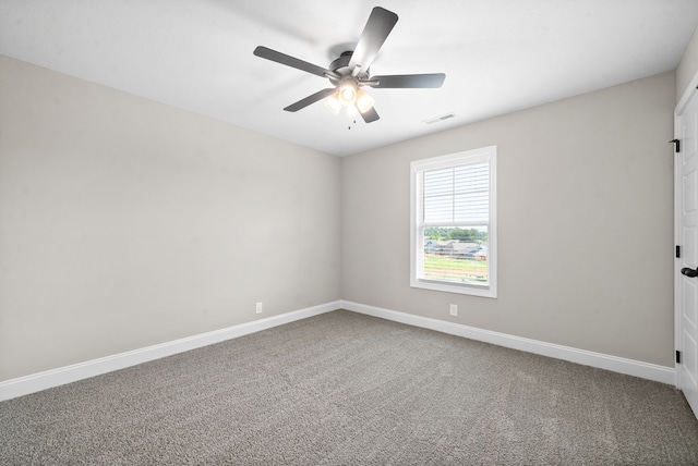 spare room with ceiling fan and carpet flooring