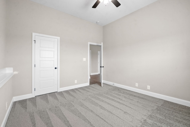 interior space with carpet and ceiling fan