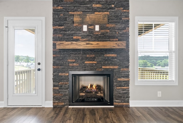 room details with hardwood / wood-style flooring and a fireplace