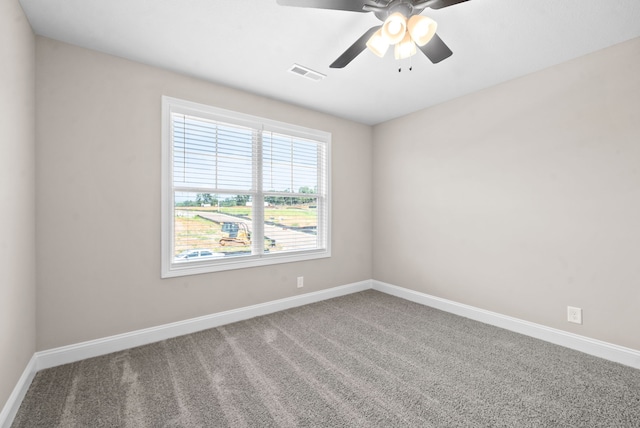 carpeted empty room featuring ceiling fan