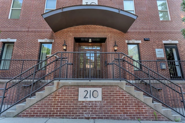 210 30th Ave N Unit 209, Nashville, TN 37203 - doorway to property featuring brick siding