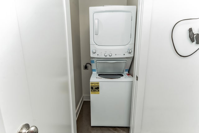 laundry room with stacked washer and clothes dryer