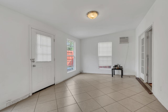 tiled entrance foyer with vaulted ceiling