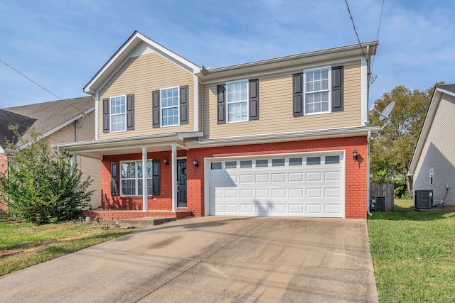 view of front of property featuring a front lawn, central AC unit, and a garage