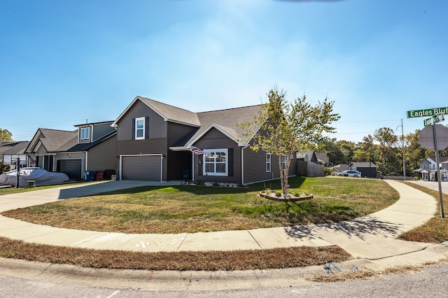 view of front facade featuring a front lawn and a garage