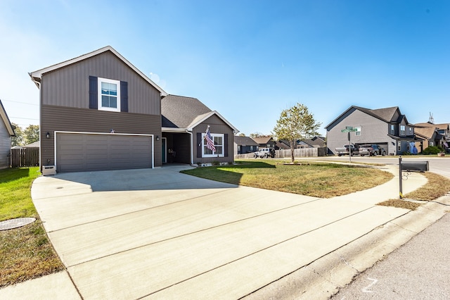 view of front of property featuring a front yard and a garage