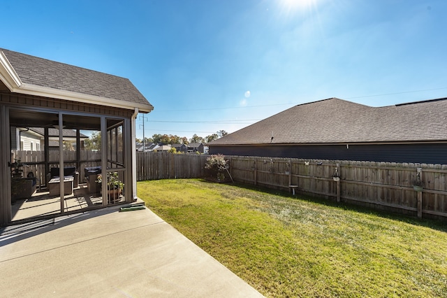 view of yard with a patio and a sunroom