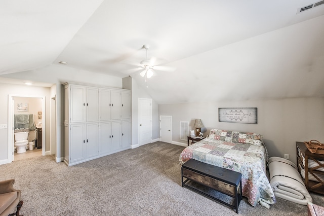 carpeted bedroom featuring connected bathroom, ceiling fan, and vaulted ceiling