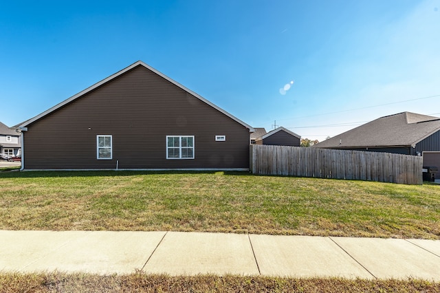 view of home's exterior with a yard