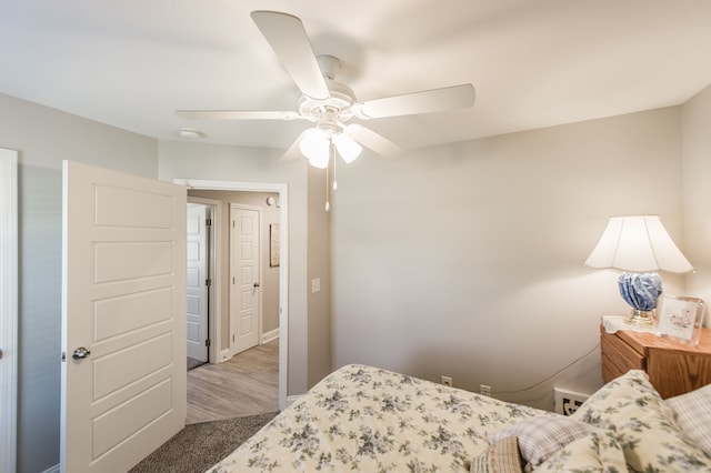 bedroom featuring light wood-type flooring and ceiling fan