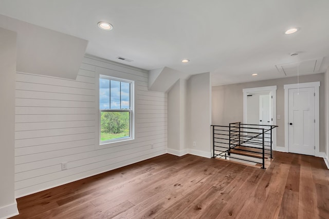 interior space with wood walls and wood-type flooring