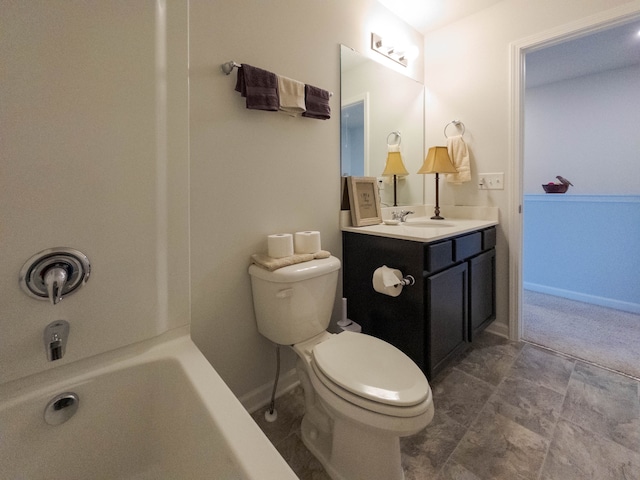 bathroom with vanity, toilet, and a bathing tub