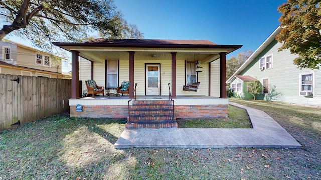 view of front of property with cooling unit and covered porch