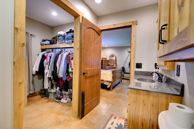 609 Whitthorne St, Shelbyville, TN 37160 - bathroom with vanity, concrete floors, connected bathroom, and recessed lighting