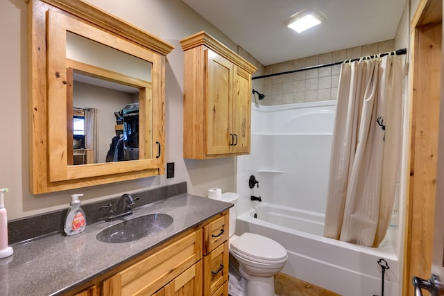 full bathroom with vanity, toilet, and shower / tub combo with curtain