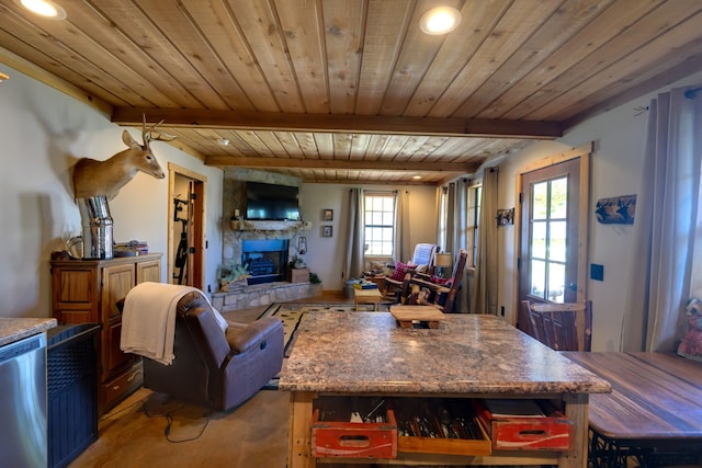 living room with a stone fireplace, wood ceiling, and beam ceiling