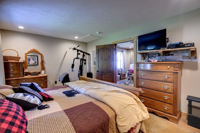 carpeted bedroom featuring a textured ceiling