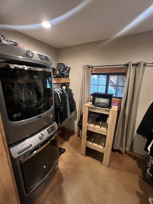 washroom with stacked washer and clothes dryer