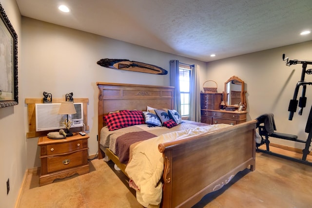 609 Whitthorne St, Shelbyville, TN 37160 - bedroom with recessed lighting, a textured ceiling, and a wall mounted air conditioner