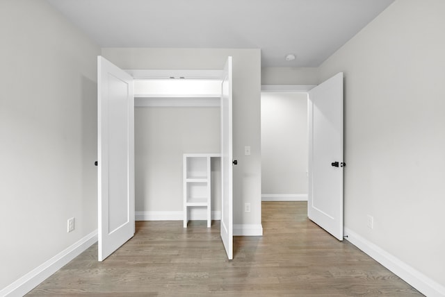 unfurnished bedroom featuring light wood-type flooring