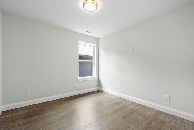 empty room featuring wood-type flooring