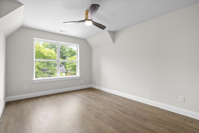 additional living space with hardwood / wood-style floors, ceiling fan, and lofted ceiling