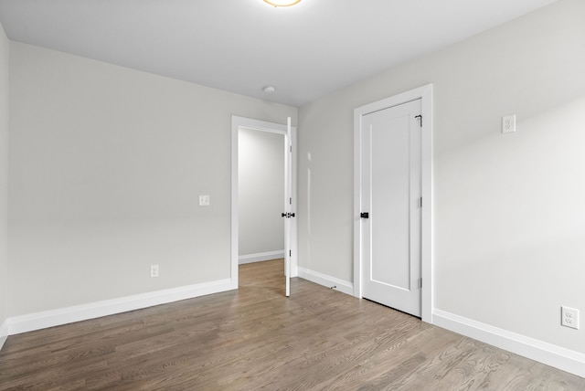 unfurnished room with light hardwood / wood-style floors