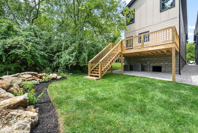 view of yard with cooling unit and a deck