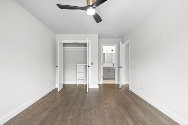 unfurnished bedroom featuring dark wood-type flooring, a closet, and ceiling fan