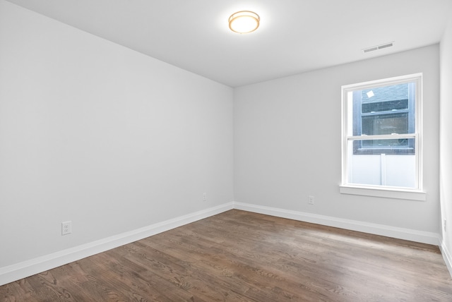 spare room featuring hardwood / wood-style floors