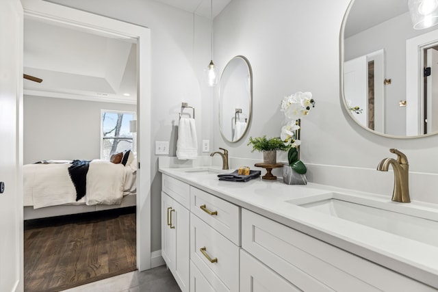 bathroom with vanity and hardwood / wood-style floors