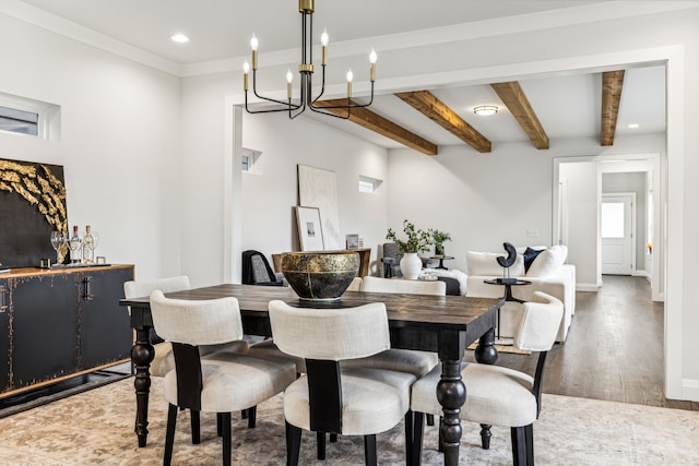 dining room featuring beamed ceiling, wood-type flooring, and crown molding