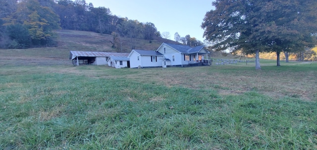 view of yard with a rural view