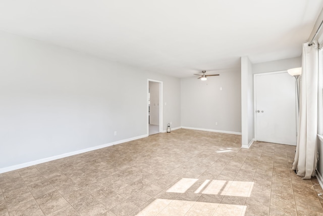 unfurnished room with ceiling fan