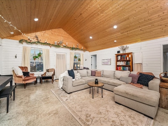 living room with high vaulted ceiling, wooden walls, and wood ceiling