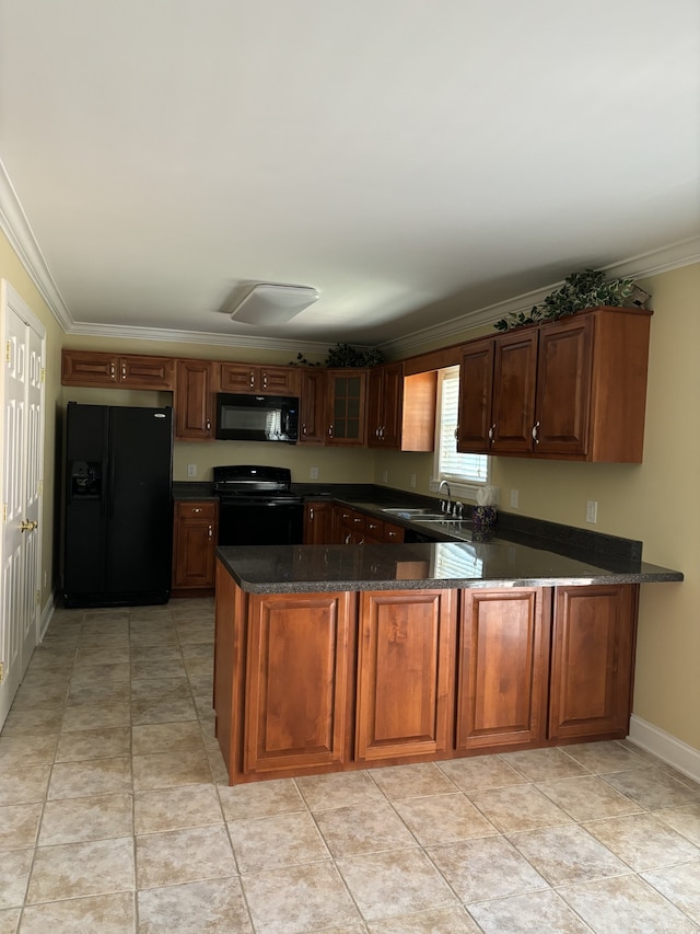 kitchen featuring kitchen peninsula, ornamental molding, black appliances, and sink