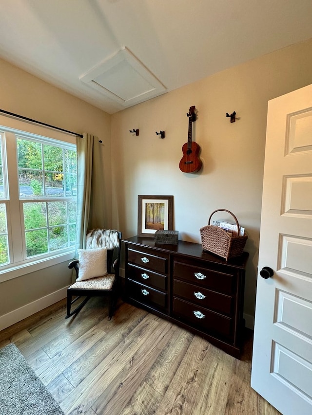 sitting room featuring light hardwood / wood-style flooring