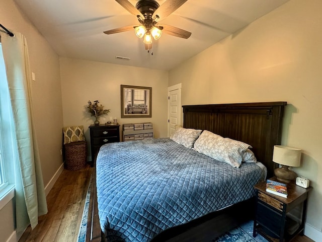 bedroom featuring dark hardwood / wood-style floors and ceiling fan