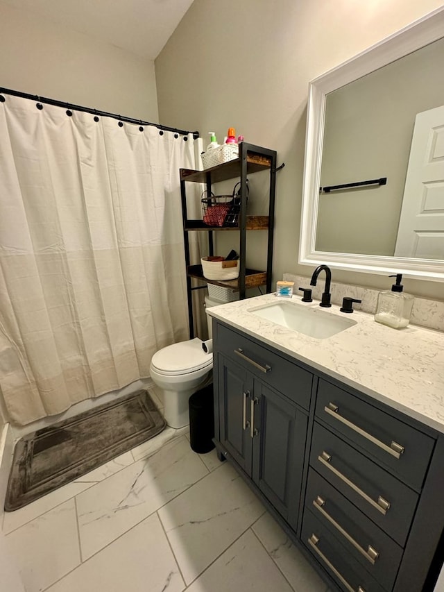 bathroom featuring vanity, a shower with curtain, and toilet