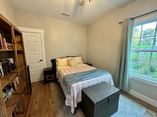 bedroom featuring ceiling fan and dark hardwood / wood-style flooring