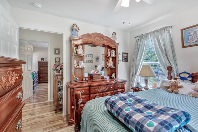 bedroom with light hardwood / wood-style floors and ceiling fan