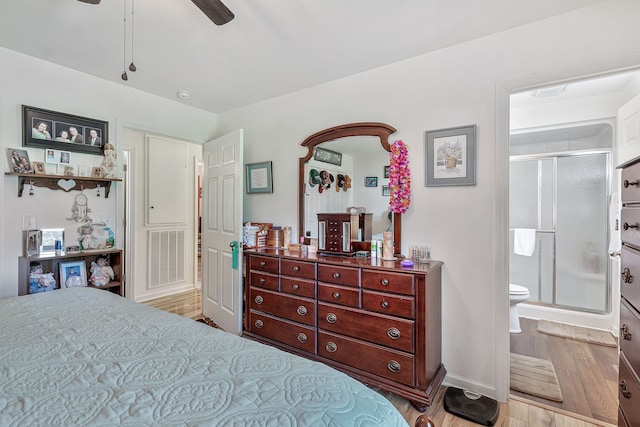 bedroom featuring light hardwood / wood-style floors, connected bathroom, and ceiling fan