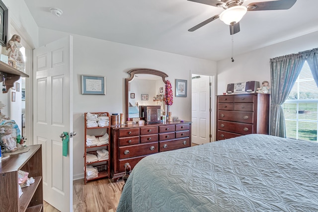 bedroom featuring ceiling fan and light hardwood / wood-style flooring