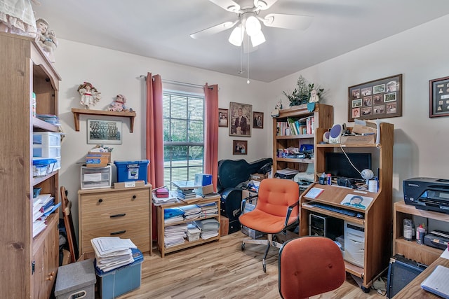 home office featuring light wood-type flooring and ceiling fan