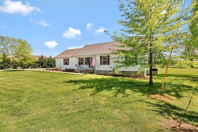 rear view of house with a yard