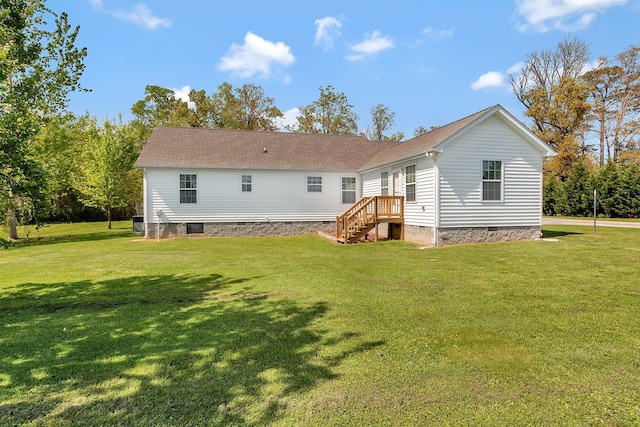 back of house with a yard