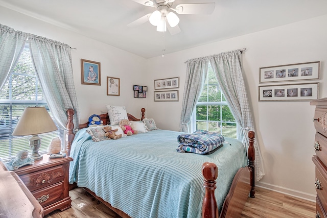 bedroom featuring ceiling fan and light wood-type flooring