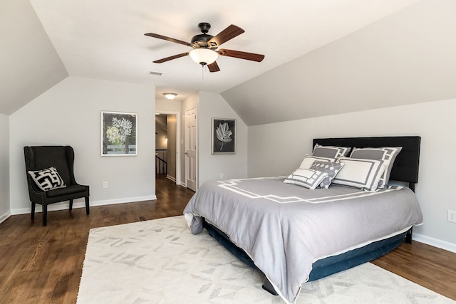 bedroom featuring lofted ceiling, dark hardwood / wood-style floors, a closet, and ceiling fan